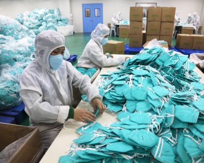 Employees work on the production line of N95 facemasks at a factory on December 8, 2022 in Xuchang, Henan Province of China. Niu Shupei/VCG via Getty Images