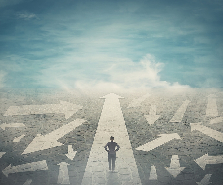 photo illustration of a person trying to choose a direction