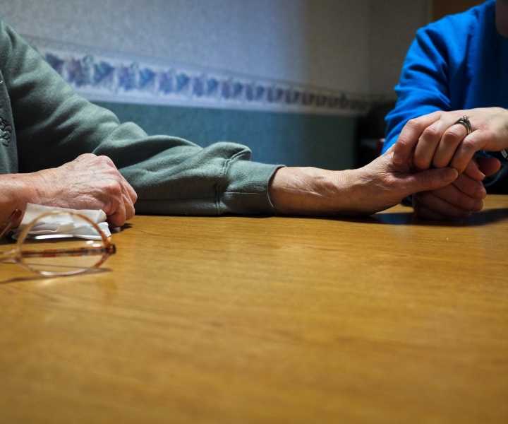 Holding Grandmother's Hand. Photograph by Amanda Mustard.