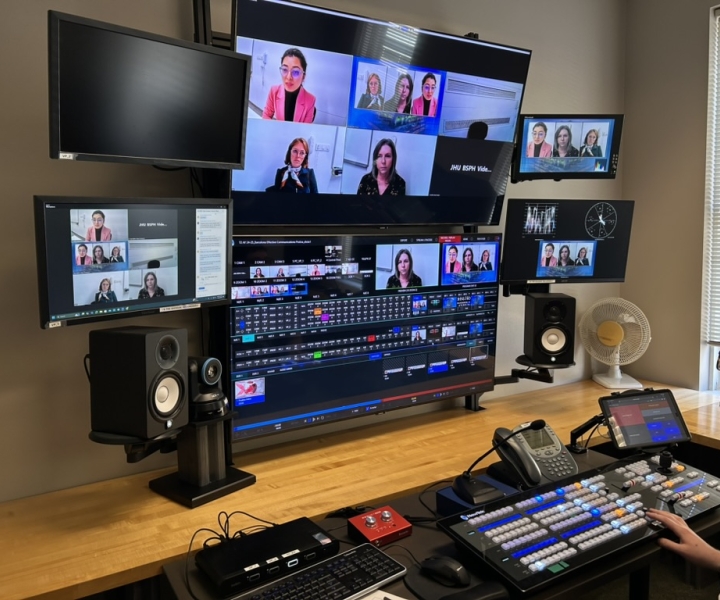 Several computers showing different shots of a studio