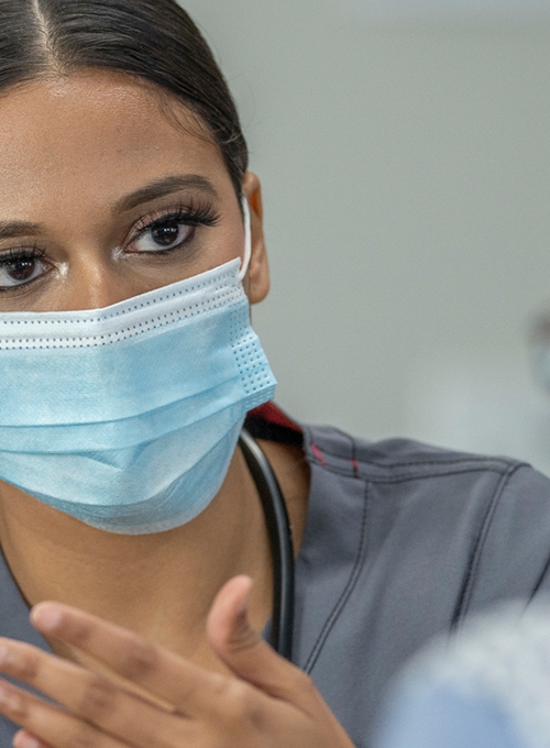 female doctor talking with male patient