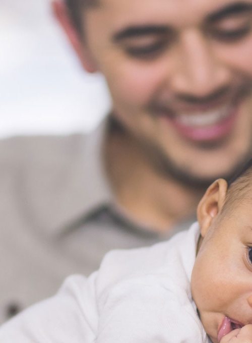 mother and father with baby