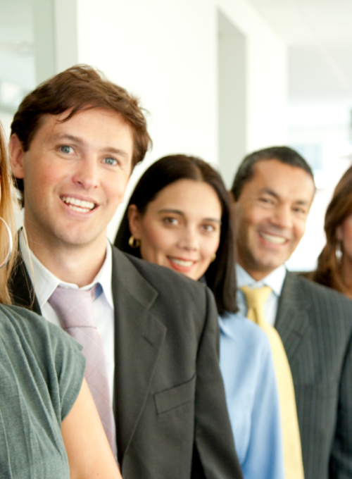 Smiling people standing in a row