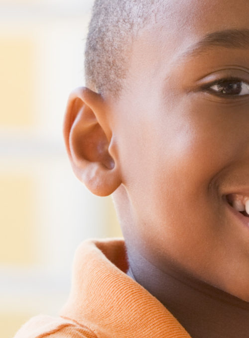 Young boy eating an apple 