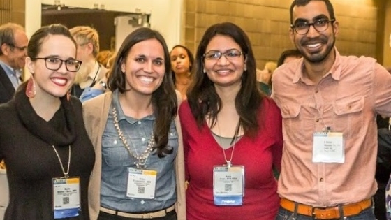 Four international students at an event Four international students at an event