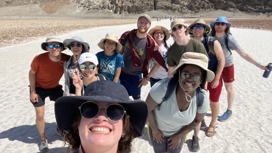 group of students in a group photo in a desert setting