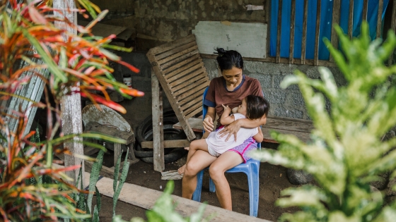 Woman breastfeeding a young child in Indonesia. Woman breastfeeding a young child in Indonesia.