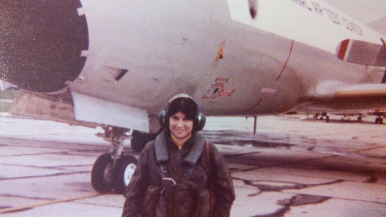 Gertrude Huster suited up for a pre-flight check in front of a P3-C aircraft, circa 1979.