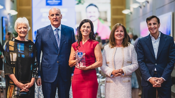 Bloomberg School leaders stand with Julia and Steve Moore to honor Elizabeth Letourneau as the inaugural Moore Family Professor