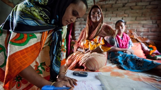 Community health worker in Bangladesh visiting a family