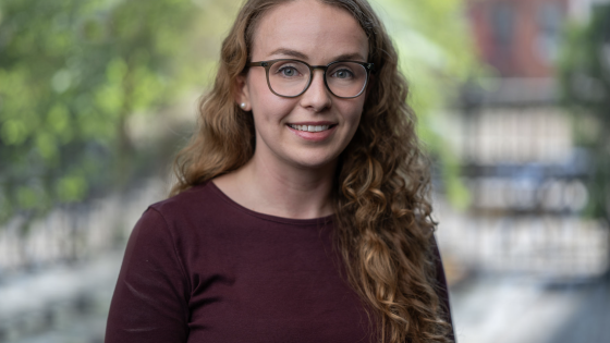 Anya O'Neal image of Anya O'Neal in crimson sweater with blurred background