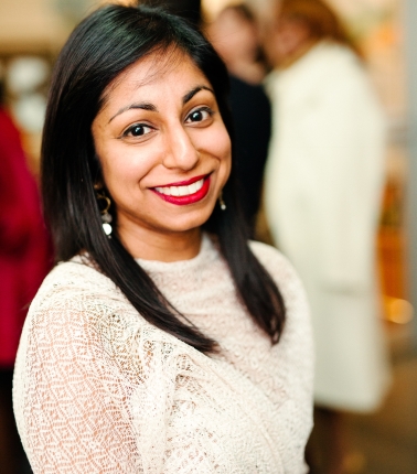 Portrait of South Asian woman with long black hair and white top