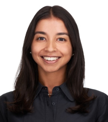 Headshot of HPM Research Associate Ilina Odouard wearing a black collared shirt and sporting an open mouth smile