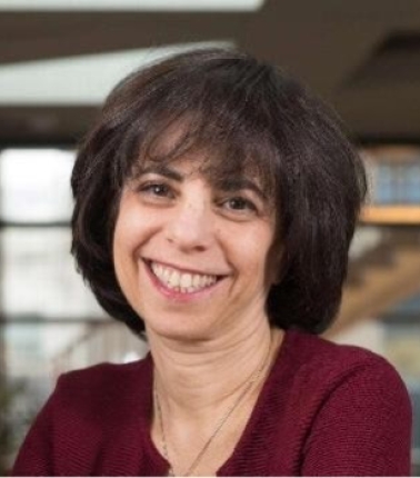 Headshot of HPM Assistant Lecturer Joanne Kenen as she sports a maroon blouse and warm smile