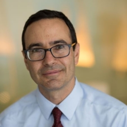 Dr. Craig Pollack smiles for a professional photo.