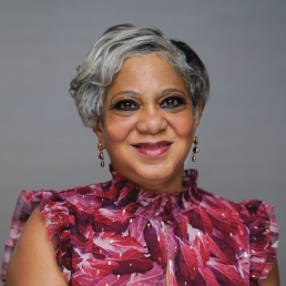 Dr. Lisa Cooper smiles for a professional photo.