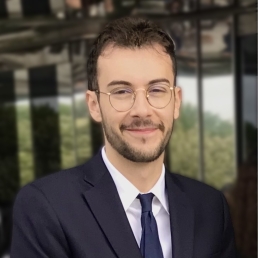 Augustin Martin Man with glasses wearing suit and tie