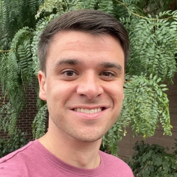 Austin Earley Man standing in front of tree