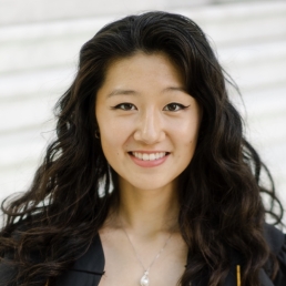 Woman with dark hair smiling