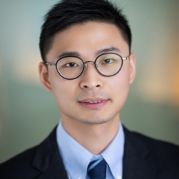 A headshot of Frank-Xu, a man with a medium-light skin tone and short black hair wearing round glasses