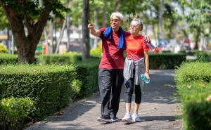 photo of older couple walking in park