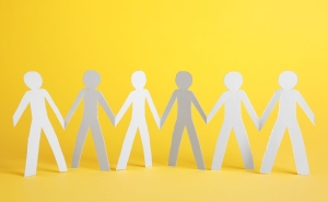 A paper stick figure chain of people holding hands