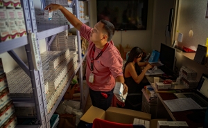 A pharmacist stocks PrEP medicine at a pharmacy in a community center operated by LoveYourself, a nonprofit impacted by the Trump administration's freeze on foreign aid, on February 19, 2025, in Mandaluyong, Metro Manila, Philippines