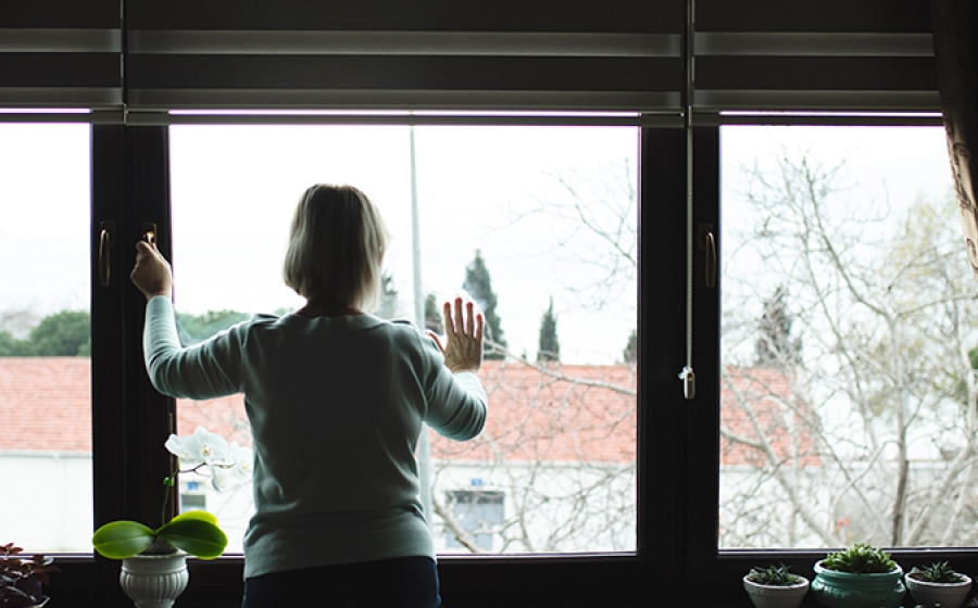 woman looking out window