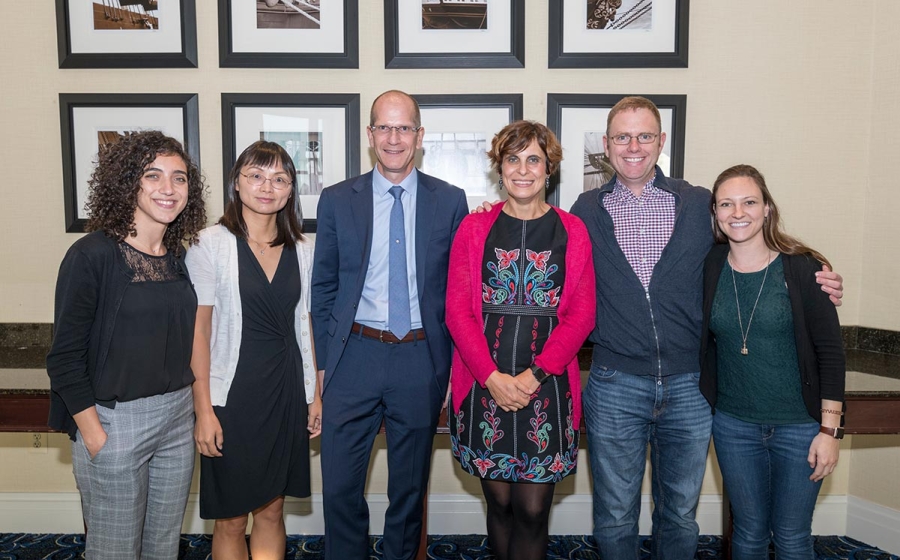 Six members of the Matunis lab stand in a row smiling