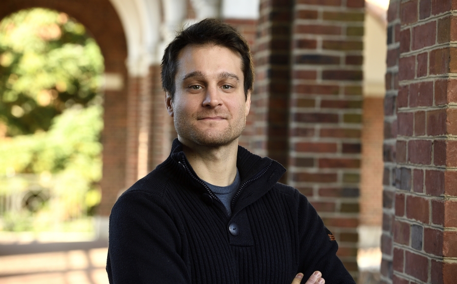 Ruggero Rossi, EHE Assistant Professor male faculty standing outside college campus