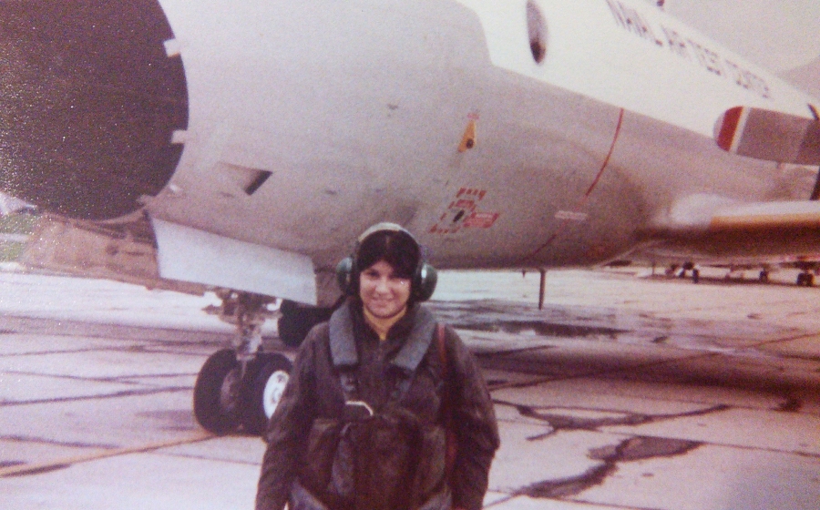 Gertrude Huster suited up for naval flight crew training Gertrude Huster suited up for a pre-flight check in front of a P3-C aircraft, circa 1979.