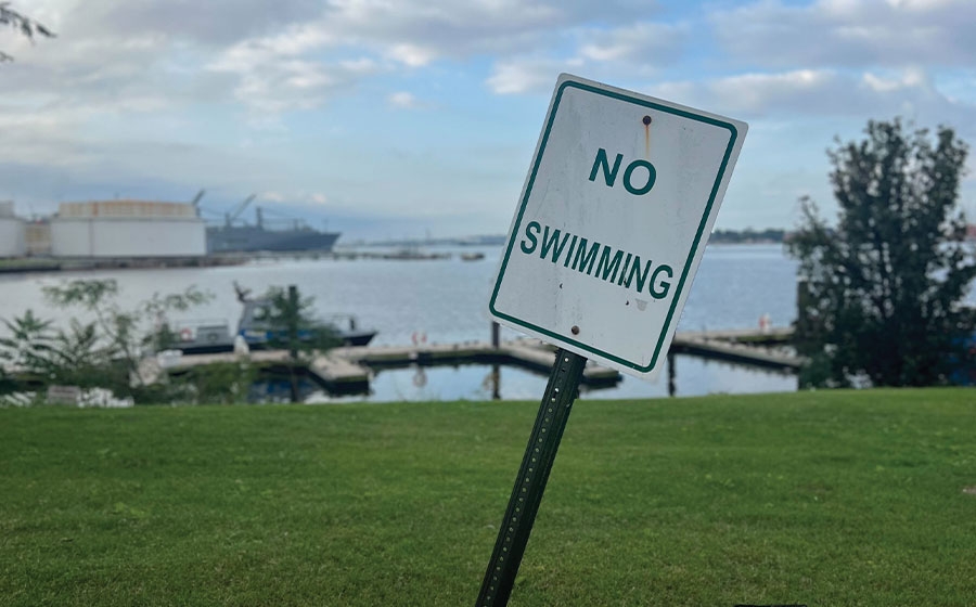 No swimming sign at waterfront