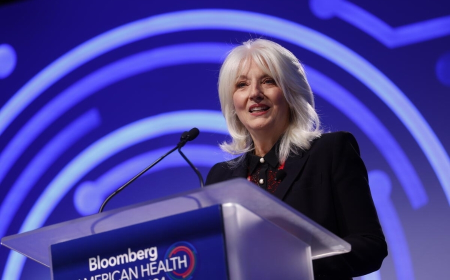 Cynthia Bissett Germanotta speaks from podium at Bloomberg American Health Summit 2024