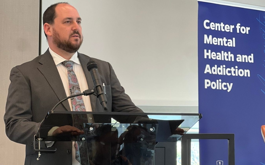 A man standing behind a podium.
