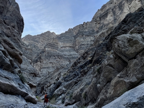 male walking through a rocky valley