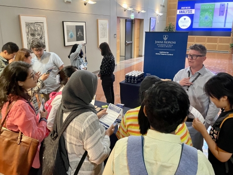 Associate Professor Ryan David Kennedy and Associate Director Kevin Welding talk to Bloomberg School of Public Health students at a recent event