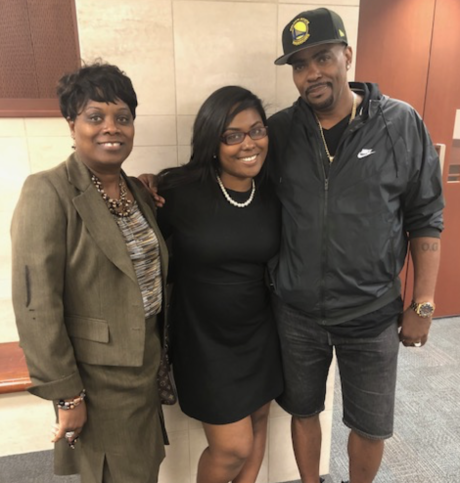 Agzja with her mother and father