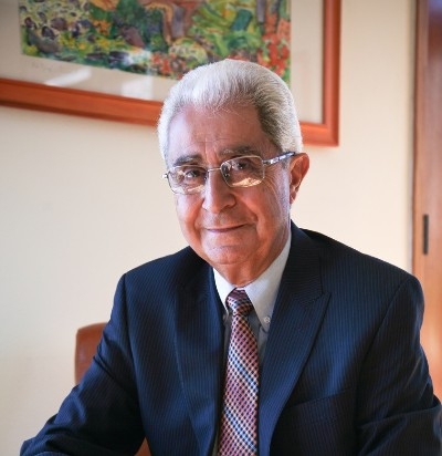 Dr. Haroutune Armenian Man with glasses, wearing a suit and tie