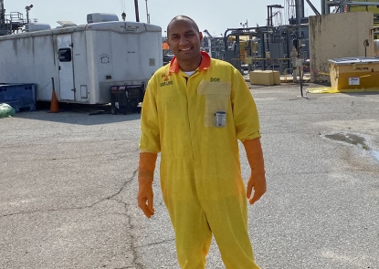 Caleb-Ginorio-Horizontal Young male on paved worksite in yellow safety suit