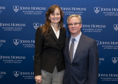 Shannon Frattaroli and Josh Horwitz in front of Johns Hopkins Bloomberg School of Public Health step-and-repeat