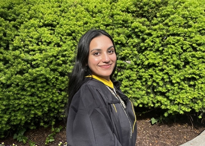 young woman wearing graduation gown