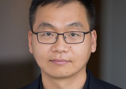 Dr. Qibin Qi poses for a professional photo.