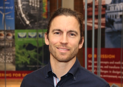 mans standing in front of a colorful background