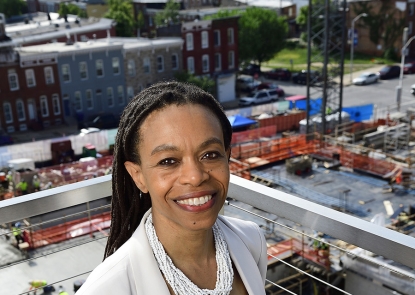 Mental Health department chair Pamela Collins Pamela Collins stands with the South Building construction site in the backgroundr