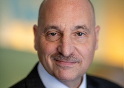head shot of man in a suit and tie