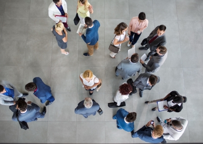 Overhead view of people in hallway